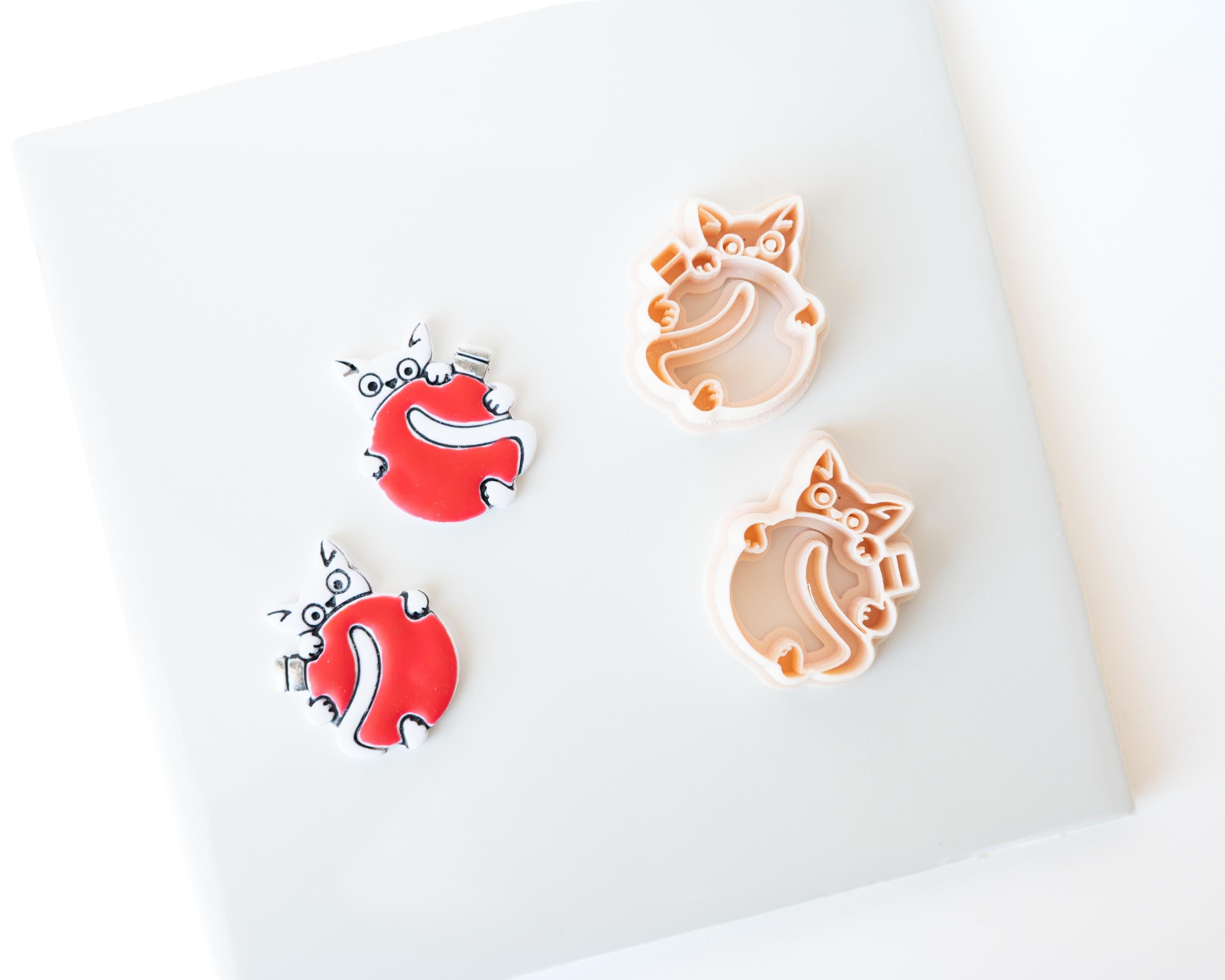Spicy Holiday Kitten Holding Ornament - Christmas Clay Cutter 2026