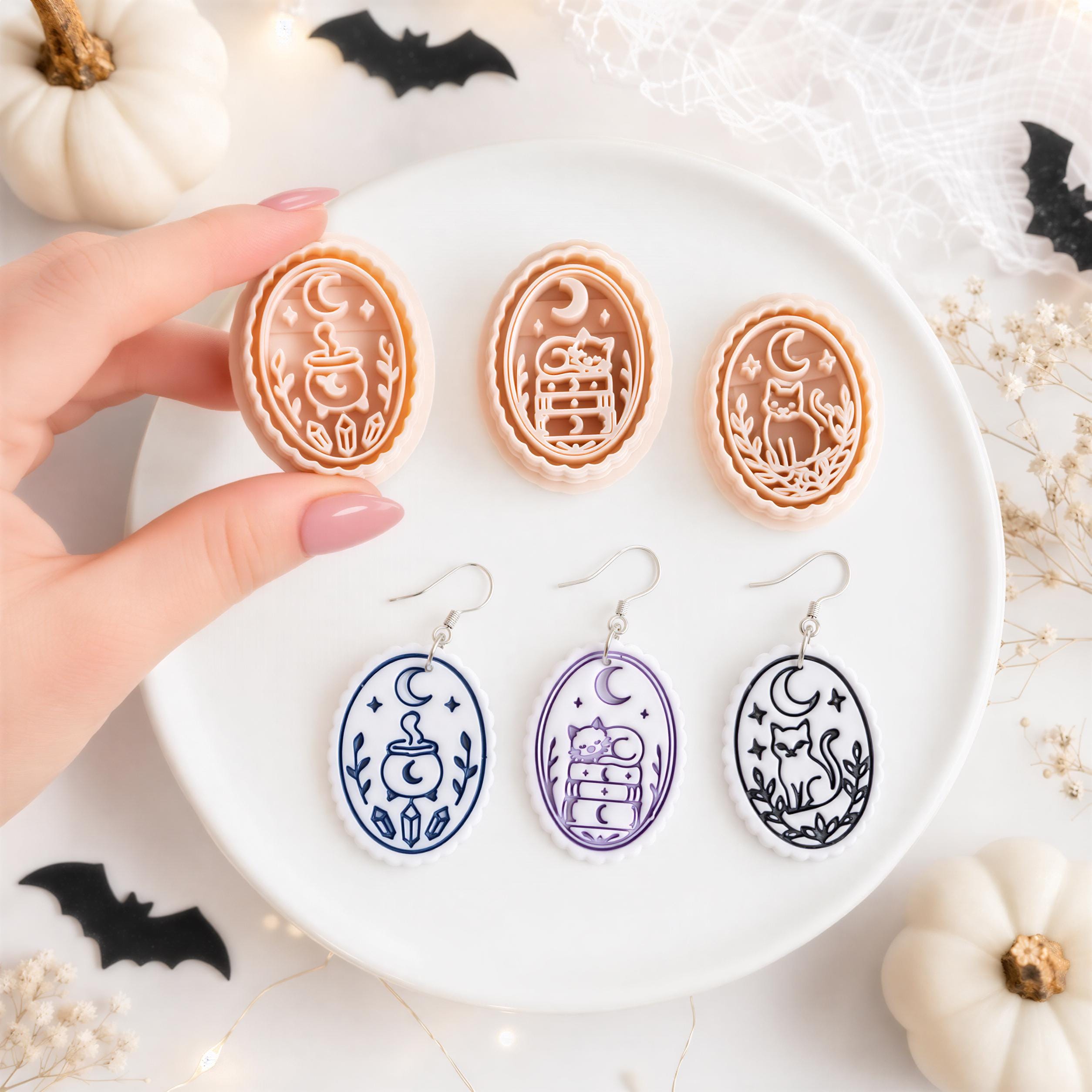Hand holding a Halloween clay cutter beside matching moon, cauldron, cat and books cutters and polymer clay earring examples.
