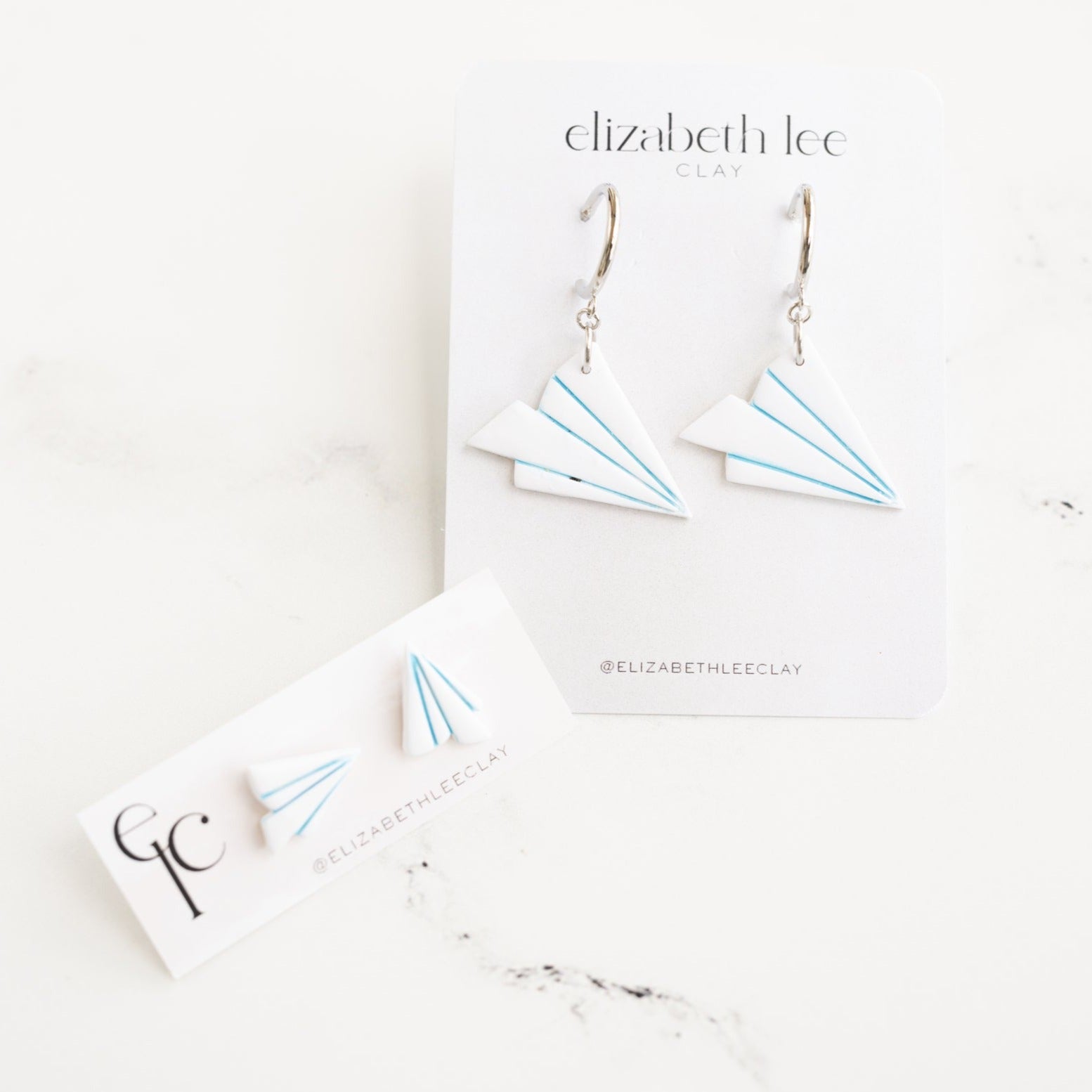 Two paper airplanes flying