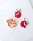 Spicy Holiday Kitten Holding Ornament - Christmas Clay Cutter 2026