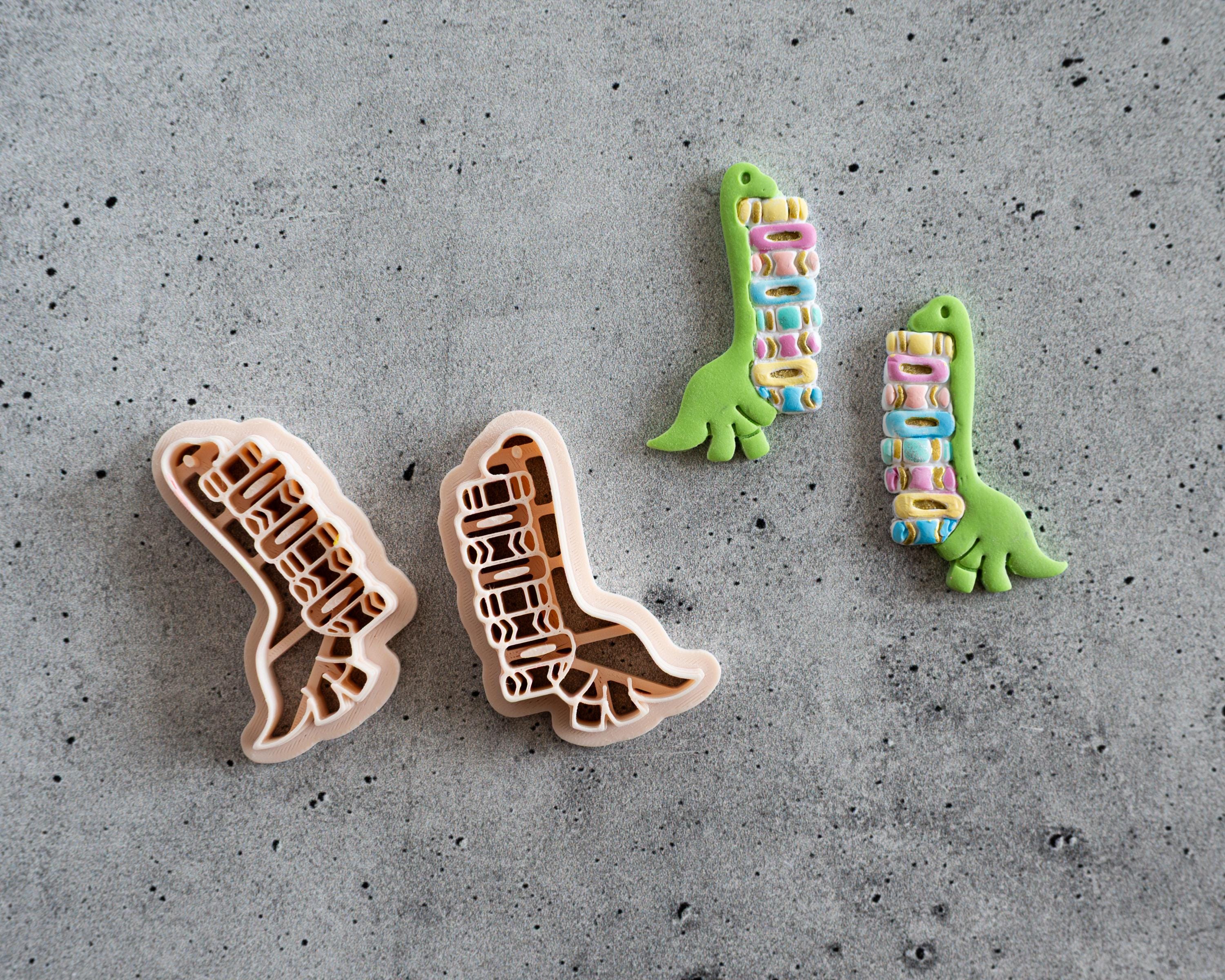 Dinosaur Carrying Books Clay Cutter
